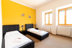 Ένα ή περισσότερα κρεβάτια σε δωμάτιο στο Hotel Prácheň