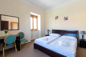 Ένα ή περισσότερα κρεβάτια σε δωμάτιο στο Hotel Prácheň