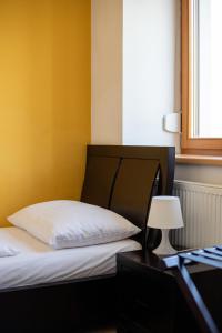 Ένα ή περισσότερα κρεβάτια σε δωμάτιο στο Hotel Prácheň