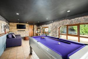 a room with a pool table in a house at The West Barn near Bath, sleeps 24 and 2 hot tubs in Bristol