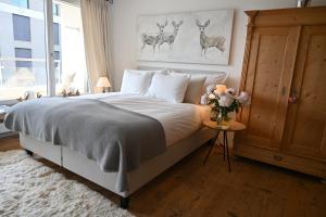 Postel nebo postele na pokoji v ubytování Residence Au Reduit Sankt Moritz