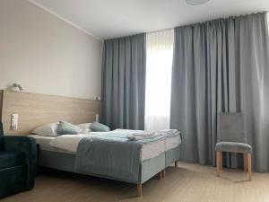 Postel nebo postele na pokoji v ubytování Pod Jabłonią