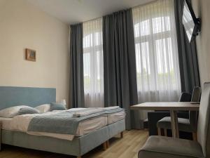 Postel nebo postele na pokoji v ubytování Pod Jabłonią
