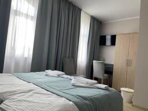 Postel nebo postele na pokoji v ubytování Pod Jabłonią