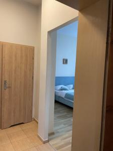 Postel nebo postele na pokoji v ubytování Pod Jabłonią
