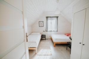 Posteľ alebo postele v izbe v ubytovaní Domki Beskidowelove Gierałtowiczki A