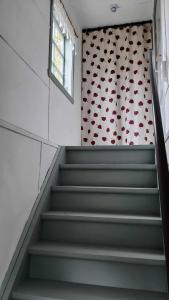 a set of stairs with a pattern of hearts on the wall at Lunden in Vittaryd