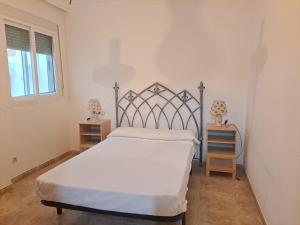 Łóżko lub łóżka w pokoju w obiekcie Apartamento Paseo del Malecón - Garrucha