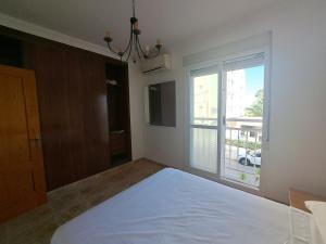 Łóżko lub łóżka w pokoju w obiekcie Apartamento Paseo del Malecón - Garrucha