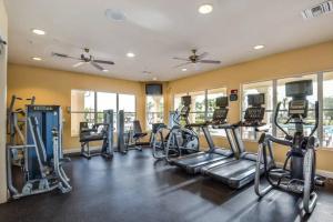 a gym with treadmills and elliptical machines at Vista Cay Condo near Conventional Center Universal, See world, Disney 8 in Orlando