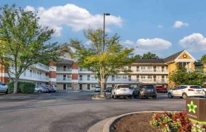 a parking lot in front of a large building at Extended Stay America Suites - Lexington - Nicholasville Road in Lexington