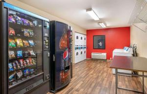 a room with a vending machine with drinks and snacks at Extended Stay America Suites - Indianapolis - Airport in Indianapolis