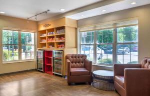 a waiting room with two chairs and windows at Extended Stay America Suites - Atlanta - Northlake in Atlanta