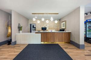 a lobby with a reception desk in a building at Comfort Inn & Suites Gallatin - Nashville Metro in Gallatin