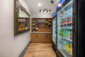 a grocery store aisle with a refrigerator and drinks at Comfort Inn & Suites Gallatin - Nashville Metro in Gallatin