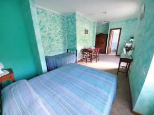 מיטה או מיטות בחדר ב-Casa Gaia