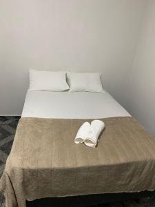 Postel nebo postele na pokoji v ubytování Kitnet Penha CEFAN ADVEC