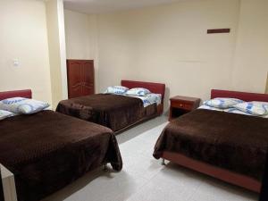 Postel nebo postele na pokoji v ubytování Hotel Vigua