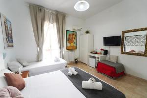 En eller flere senge i et værelse på Cicero Rome Center