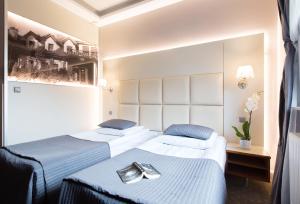 Postel nebo postele na pokoji v ubytování Hotel Galicja Wellness & SPA