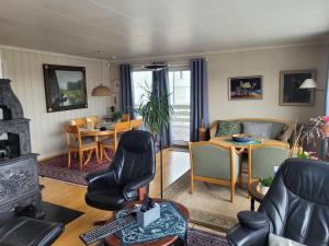 a living room with a couch and a table at Hus ved Lillestrøm by in Lillestrøm