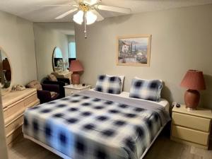 a bedroom with a bed and a living room at ROYAL GARDEN RESORT 1510 condo in Myrtle Beach