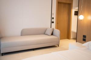 Postel nebo postele na pokoji v ubytování Colosseum Hotel