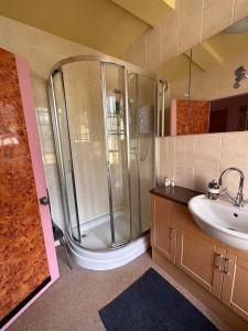 a bathroom with a shower and a sink at Green Dragon LUDLOW in Ludlow +7 photos