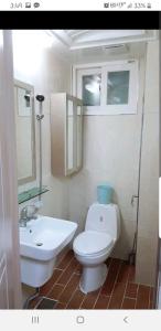 a bathroom with a white toilet and a sink at Changdong Property in Seoul