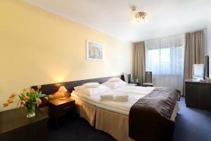 Postel nebo postele na pokoji v ubytování Hotel IKAR