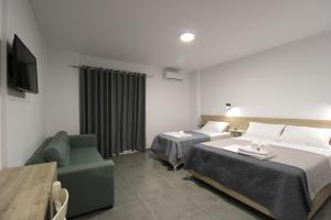 Postel nebo postele na pokoji v ubytování Hotel Villa Adrian