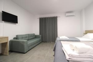 Postel nebo postele na pokoji v ubytování Hotel Villa Adrian