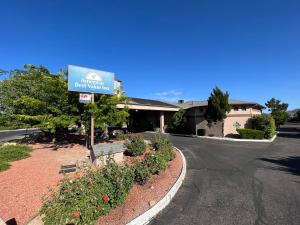 a sign for a hotel on the side of a road at Americas Best Value Inn Prescott Valley in Prescott Valley