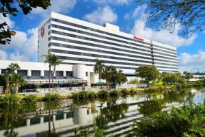 a building with a river in front of it at Sheraton Miami Airport Hotel and Executive Meeting Center in Miami