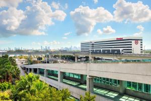 an office building with a bridge in the background at Sheraton Miami Airport Hotel and Executive Meeting Center in Miami