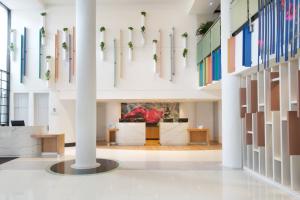 a view of the lobby of a building with white columns at Sheraton Miami Airport Hotel and Executive Meeting Center in Miami