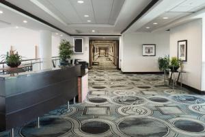 a lobby with a tile floor and a hallway at Sheraton Miami Airport Hotel and Executive Meeting Center in Miami +37 photos