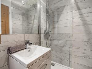 a white bathroom with a sink and a shower at Waterside Lodge Fifteen - Uk36708 in Southowram
