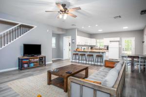 a living room with a couch and a table at River Rock Retreat in Bandera