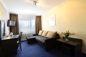 TV a/nebo společenská místnost v ubytování Hotel IKAR