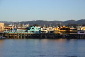 a group of houses on a dock on the water at 3896 Gather and Rest home in Del Rey Oaks