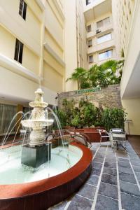 a fountain in the courtyard of a building at Victory Sai Gon Hotel in Ho Chi Minh City