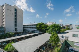 an overhead view of a city with a building at Baan Sutra Guesthouse in Phuket