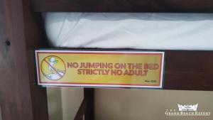 a sign that says no jumping on the bedrity noault at The Grand Beach Resort Port Dickson in Port Dickson