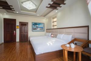 Voodi või voodid majutusasutuse Tasme Hotel toas