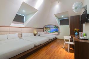 Voodi või voodid majutusasutuse Tasme Hotel toas