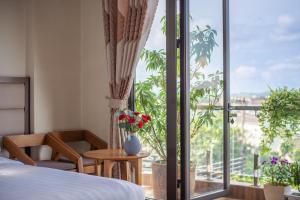Voodi või voodid majutusasutuse Tasme Hotel toas
