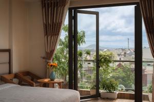 Voodi või voodid majutusasutuse Tasme Hotel toas