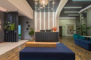The lobby or reception area at Tasme Hotel