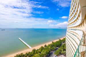 a view of the beach from a building at Four Points by Sheraton Hainan, Sanya in Sanya